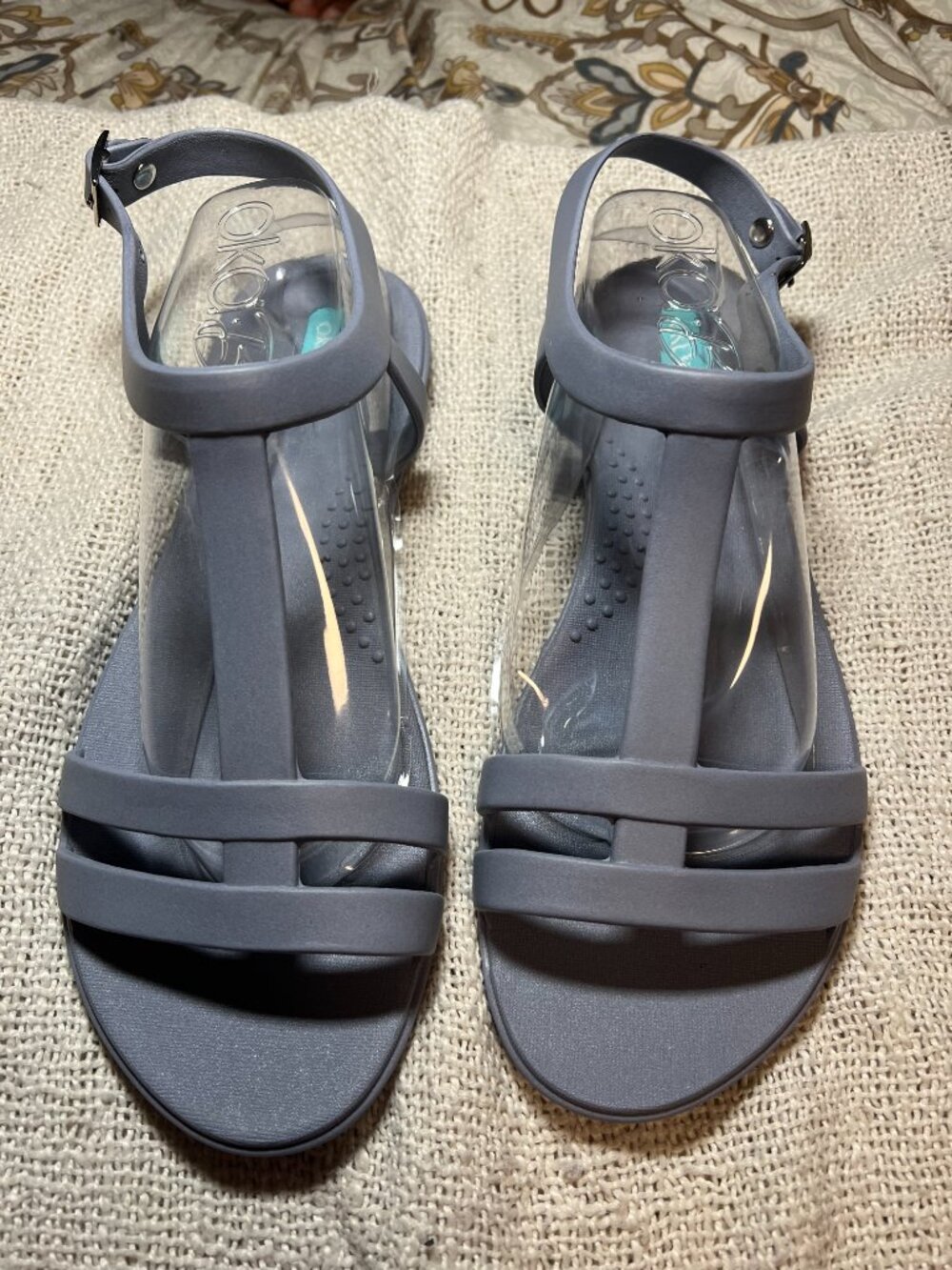 These are Oka-B Women's Morgan Flat Sandals in a light blue shade, size 8.